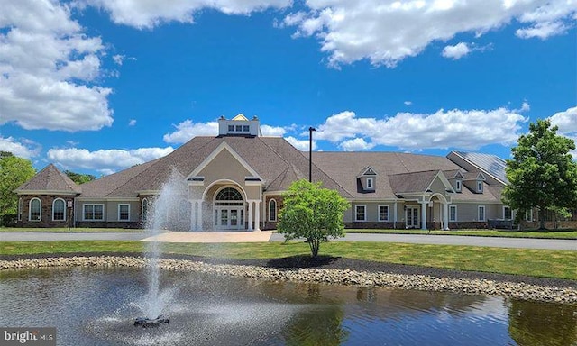 exterior space with a water view