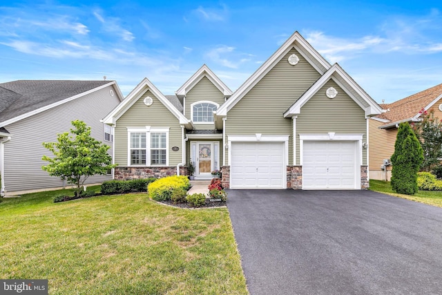 view of front property with a garage and a front yard