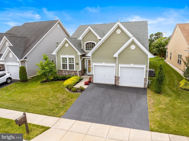 view of front of house featuring a front yard and central AC unit