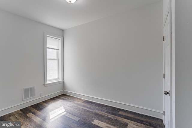 unfurnished room featuring dark hardwood / wood-style floors