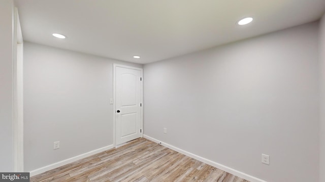 unfurnished room with light wood-type flooring