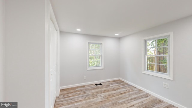 unfurnished room with light hardwood / wood-style floors