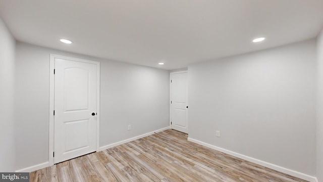 spare room with light wood-type flooring