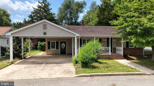 view of front of house featuring a porch and a carport