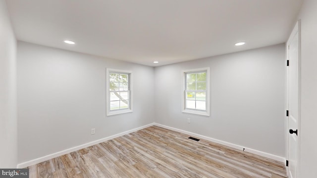 unfurnished room featuring light wood-type flooring