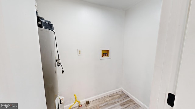 washroom featuring washer hookup and light hardwood / wood-style floors