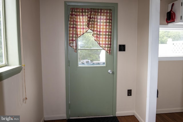 entryway with dark hardwood / wood-style floors