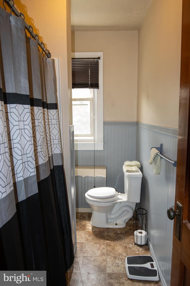 bathroom featuring tile patterned flooring and toilet