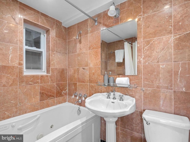 bathroom featuring toilet, tile walls, and shower / tub combo