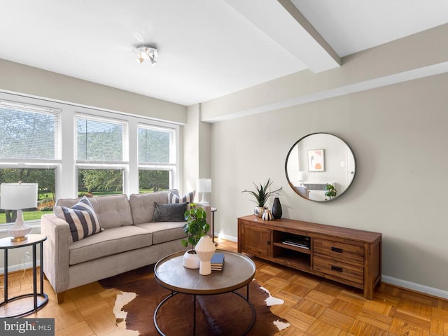 living room with light parquet flooring and beamed ceiling