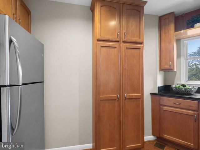 kitchen featuring stainless steel refrigerator