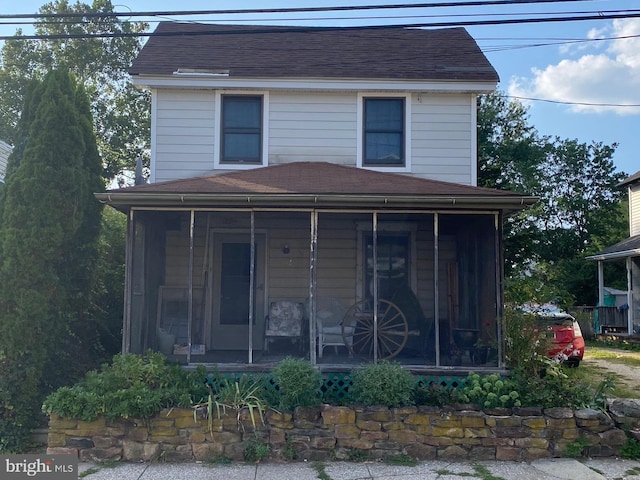 exterior space featuring a sunroom