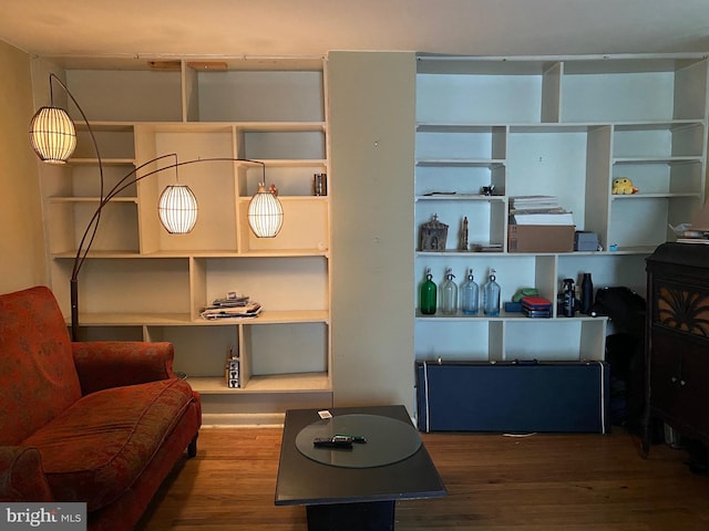 sitting room with hardwood / wood-style floors