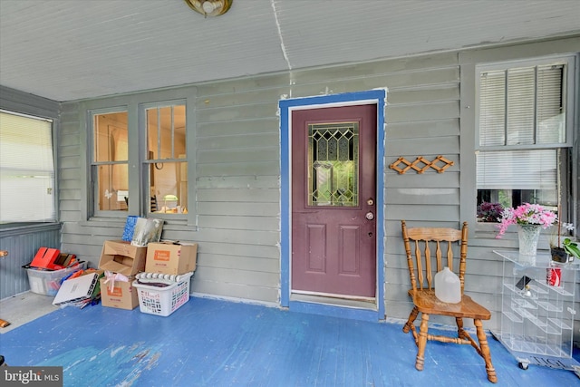 property entrance with covered porch