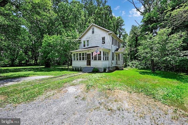 view of front of property with a front lawn