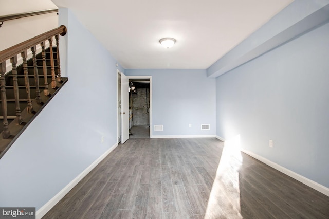 unfurnished room with dark hardwood / wood-style floors