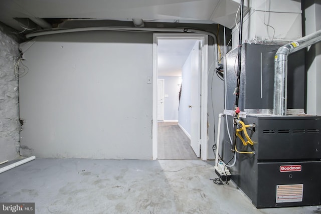 utility room featuring heating unit