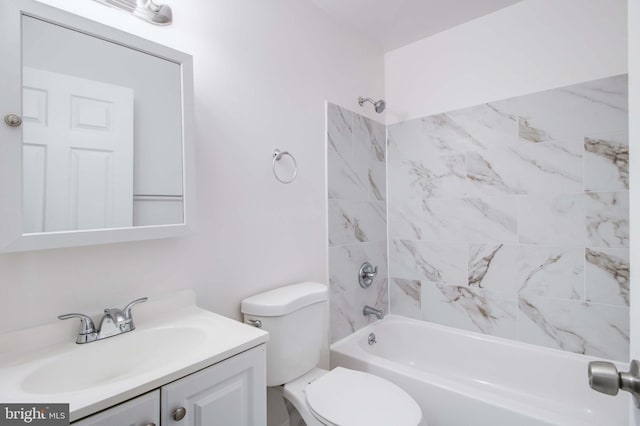 full bathroom with tiled shower / bath combo, vanity, and toilet