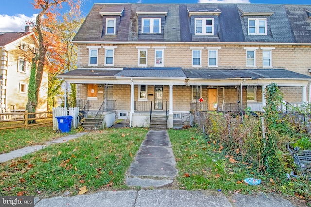 townhome / multi-family property with covered porch