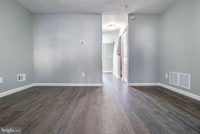 unfurnished room featuring dark hardwood / wood-style floors