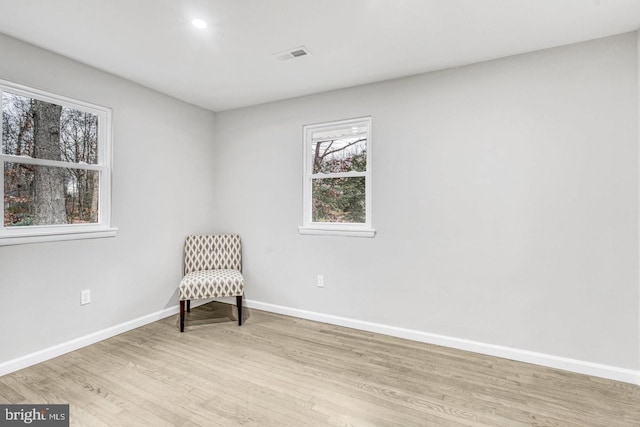 unfurnished room featuring light hardwood / wood-style floors