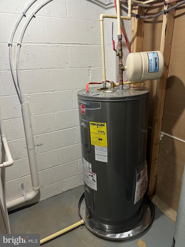 utility room featuring water heater