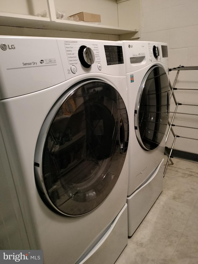 laundry area with washer and clothes dryer