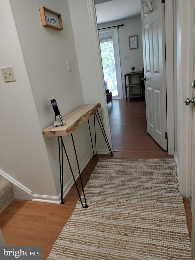 hallway featuring hardwood / wood-style floors