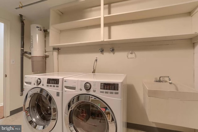 washroom featuring washing machine and clothes dryer and sink