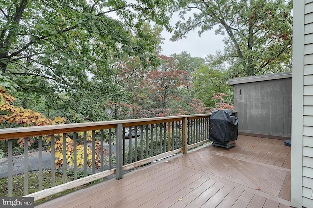 wooden terrace featuring grilling area