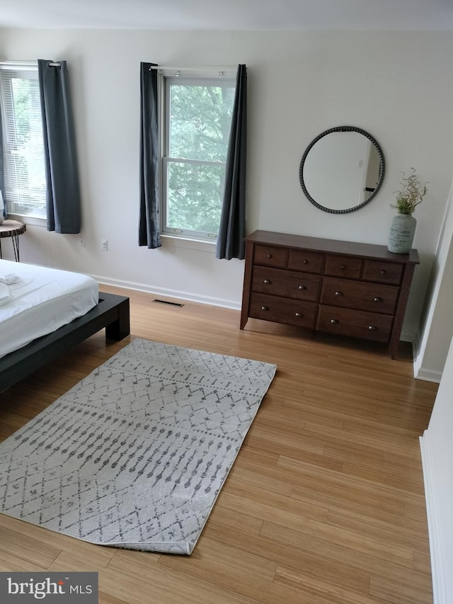 bedroom with light hardwood / wood-style flooring