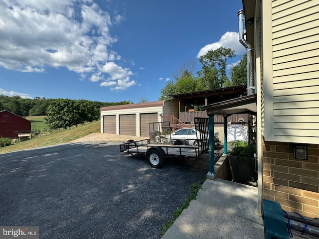 view of car parking with a garage