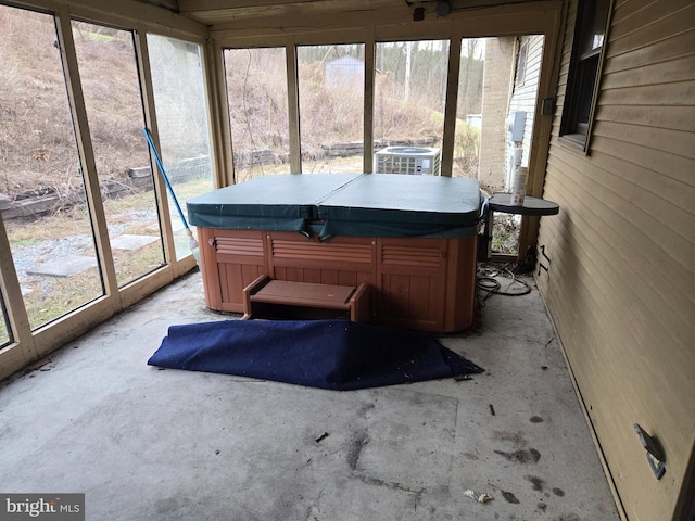 sunroom with a jacuzzi