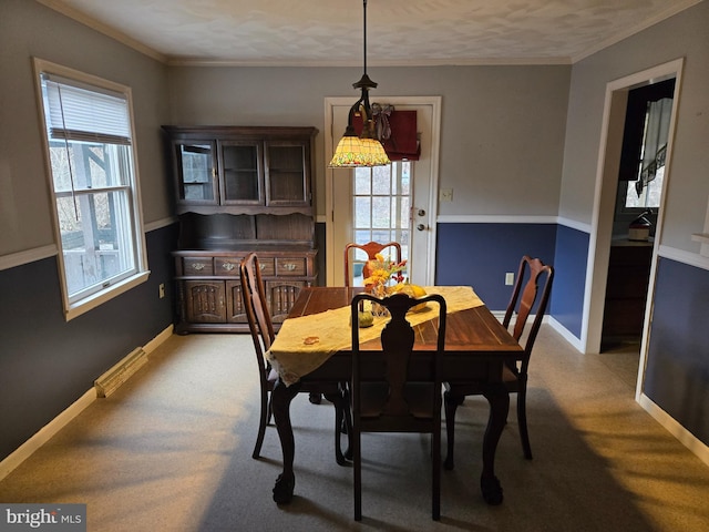 dining space featuring ornamental molding