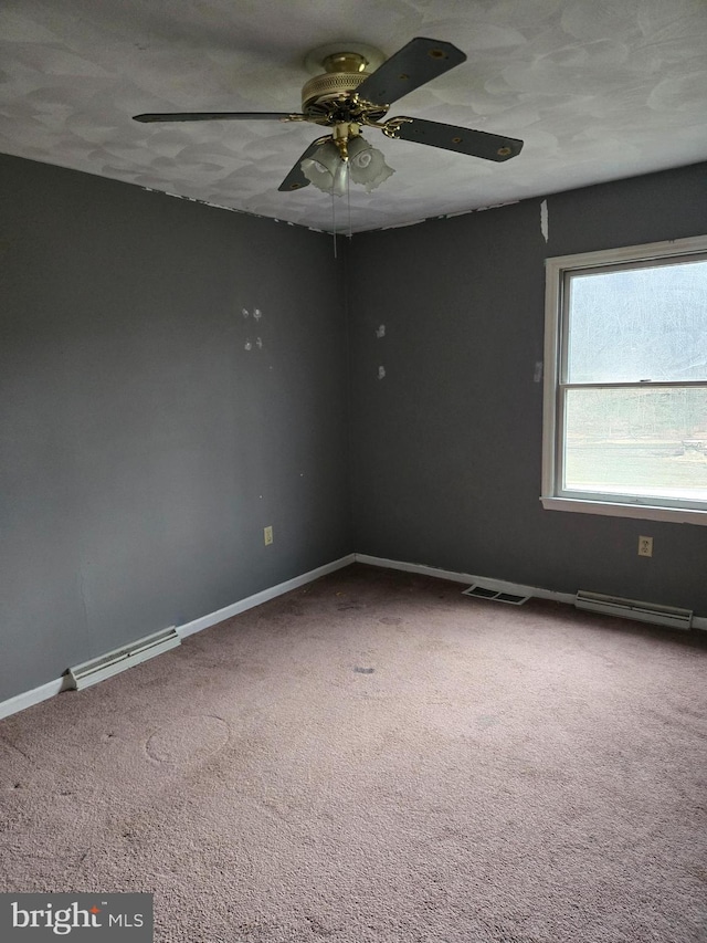 carpeted empty room featuring a textured ceiling and ceiling fan