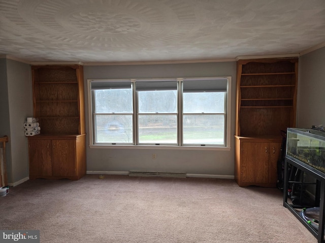 unfurnished living room with light colored carpet and ornamental molding