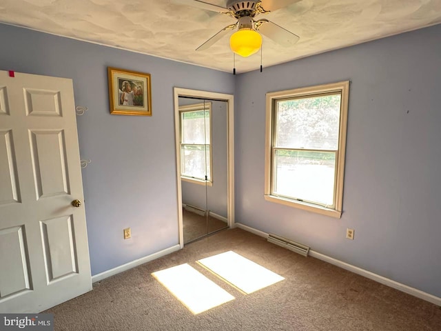 carpeted empty room featuring ceiling fan