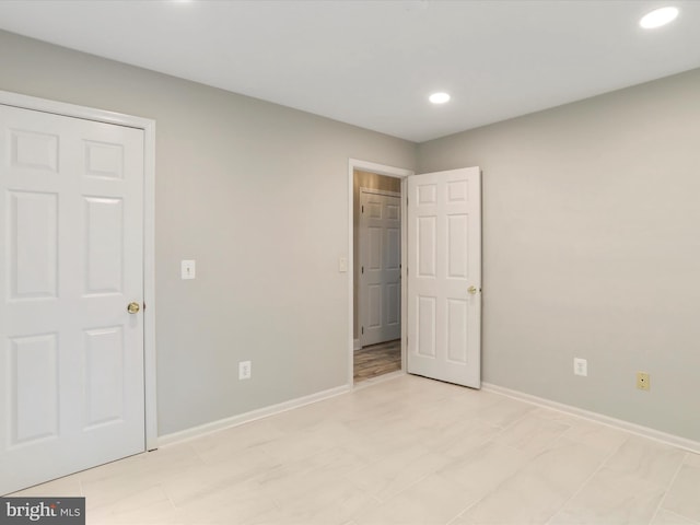 unfurnished bedroom with light tile patterned floors