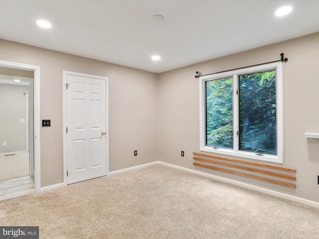 empty room featuring light carpet