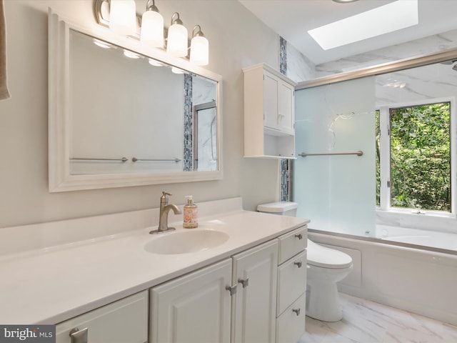 full bathroom featuring a skylight, toilet, a wealth of natural light, and vanity