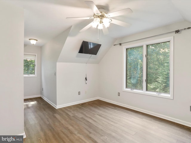 bonus room with vaulted ceiling, hardwood / wood-style floors, and ceiling fan