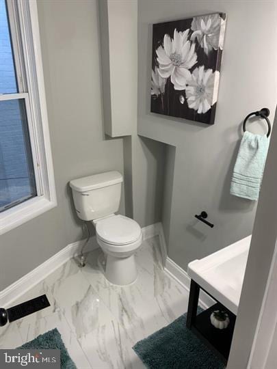 bathroom featuring toilet and vanity