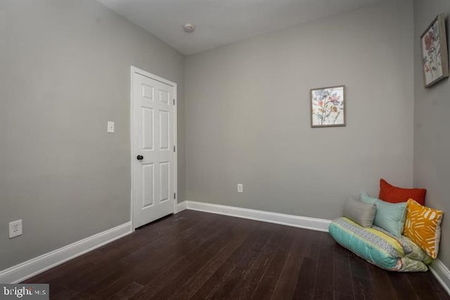 sitting room featuring dark hardwood / wood-style floors