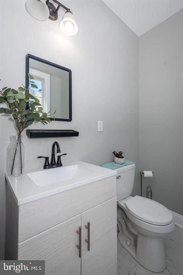 bathroom with toilet and vanity