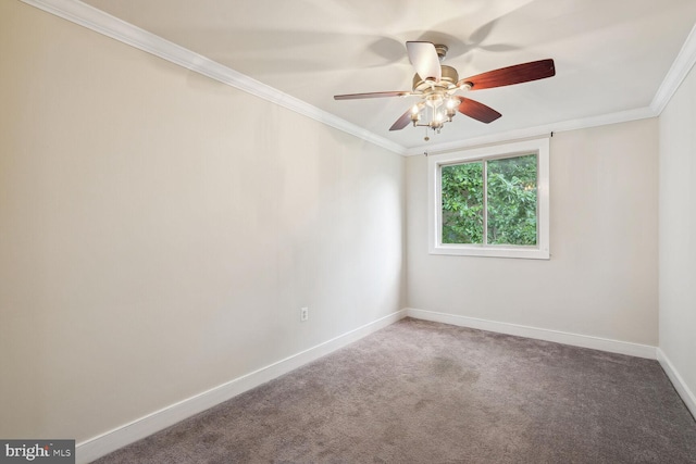 carpeted empty room featuring ceiling fan and crown molding