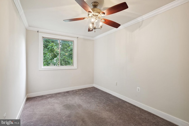 carpeted empty room featuring ornamental molding and ceiling fan