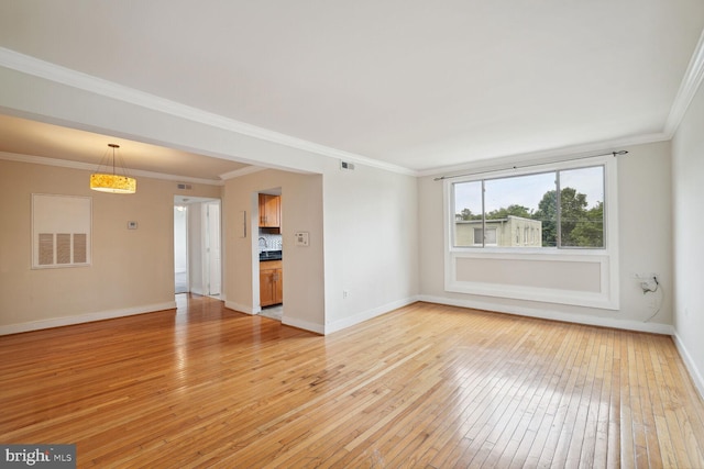 unfurnished living room with light hardwood / wood-style floors and ornamental molding