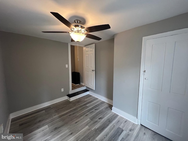 interior space featuring ceiling fan and hardwood / wood-style floors