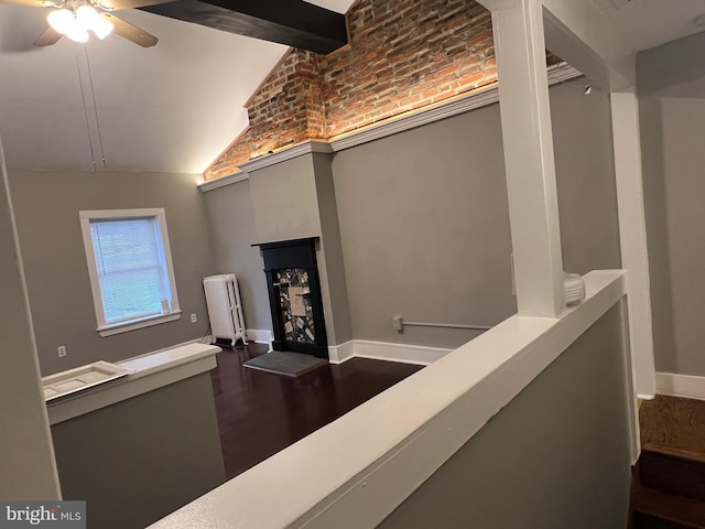 interior space with high vaulted ceiling, radiator, dark hardwood / wood-style floors, and beamed ceiling