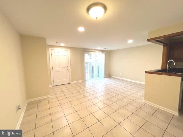 view of tiled spare room